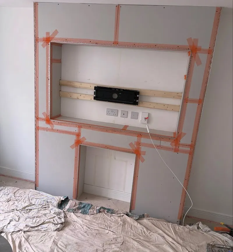 Media wall boarded, taped and beaded, ready for plaster
